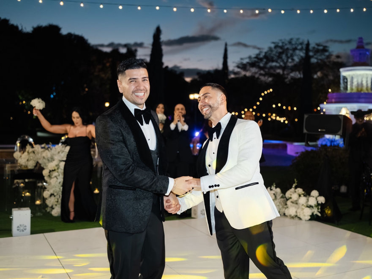 Gay couple enjoying their wedding on the dance floor