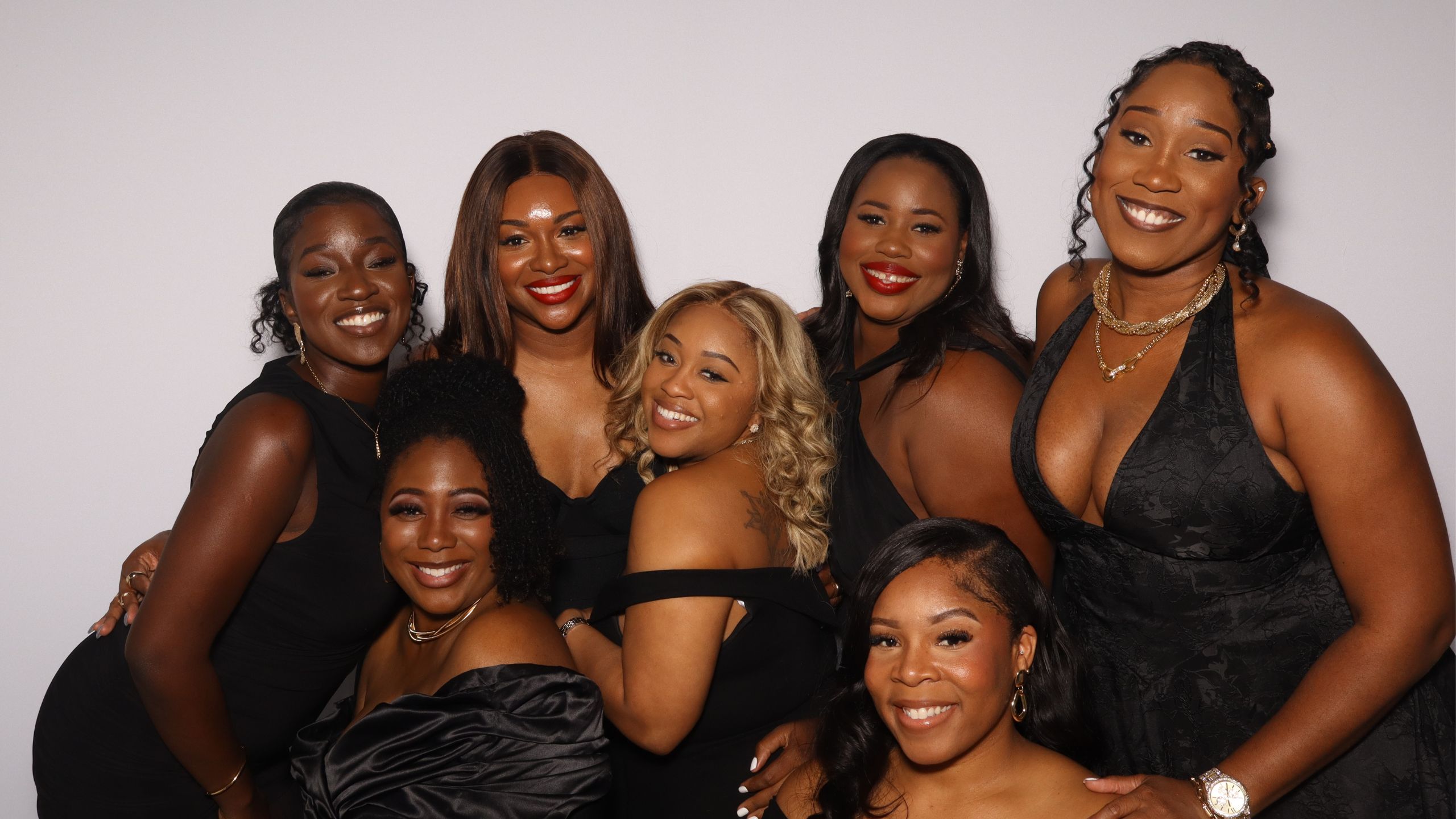 Group of guests posing in an Xpress Entertainment photo booth