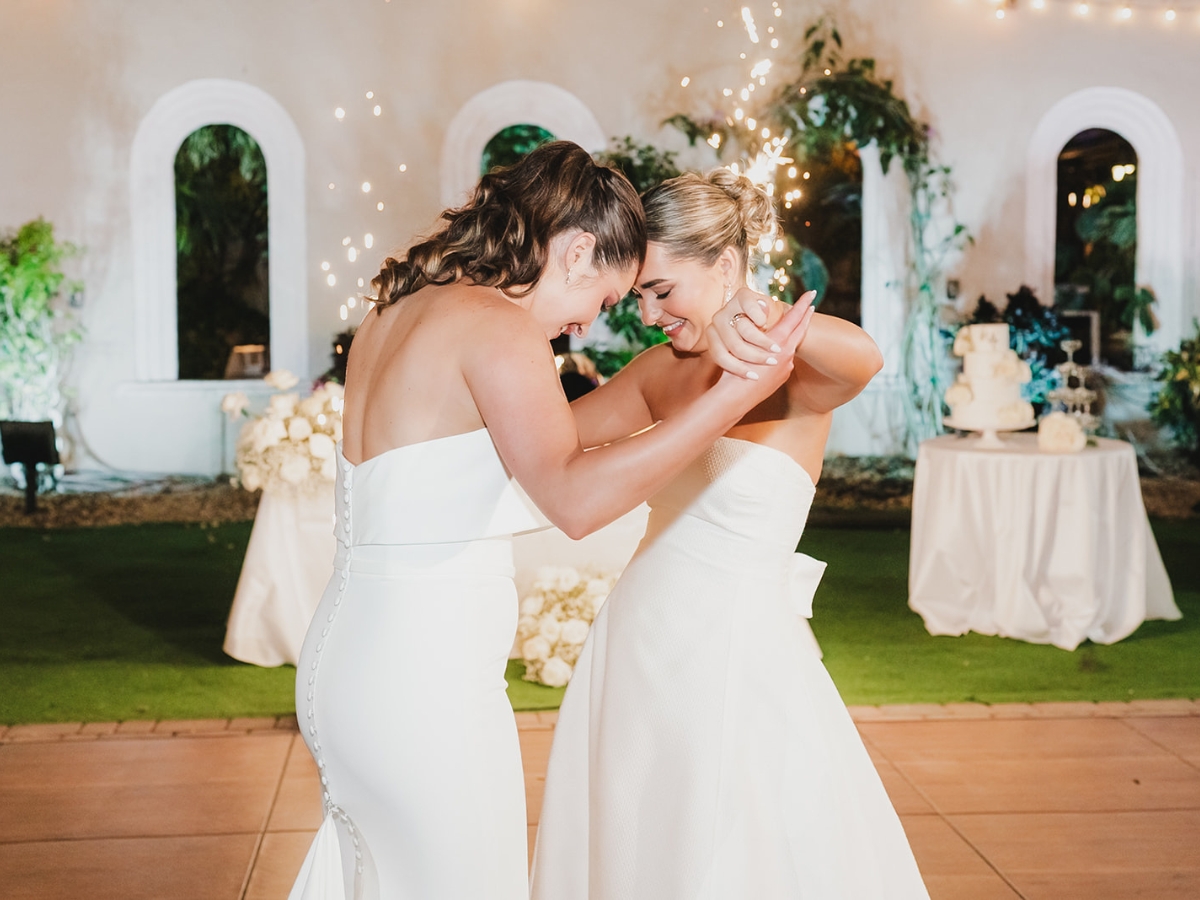 Lesbian couple sharing their first dance during their wedding